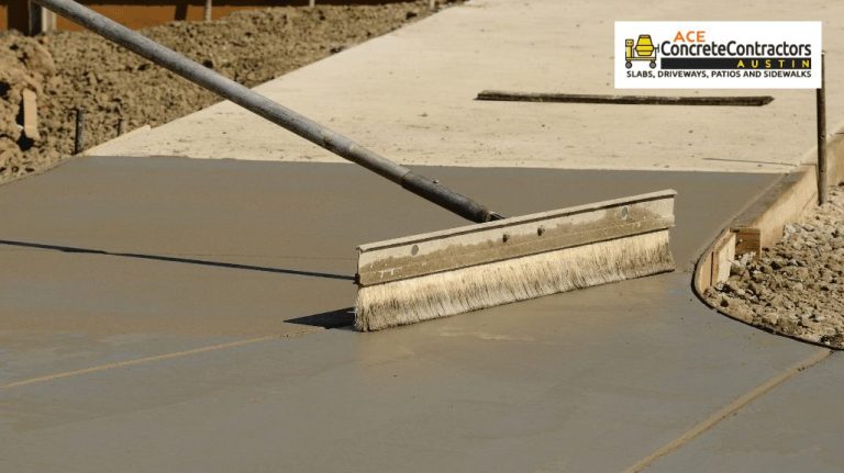 Contractor using a finishing tool to flattened a wet concrete surface