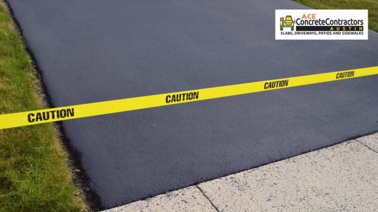 new asphalt driveway and caution tape barricade for safety