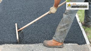 concrete contractor installing asphalt driveway