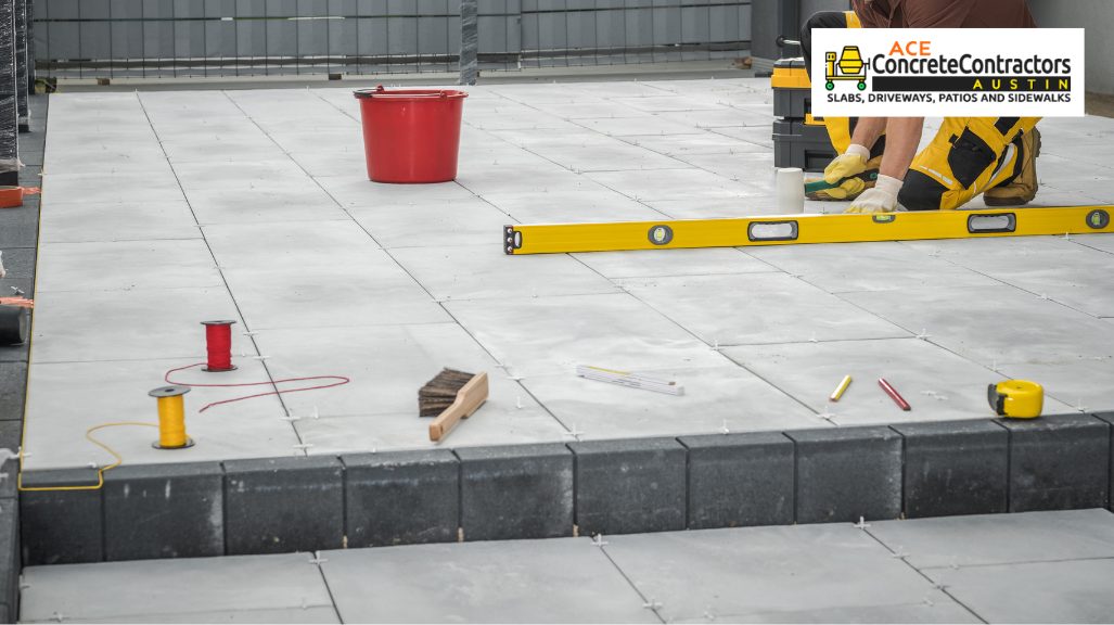 person leveling concrete patio