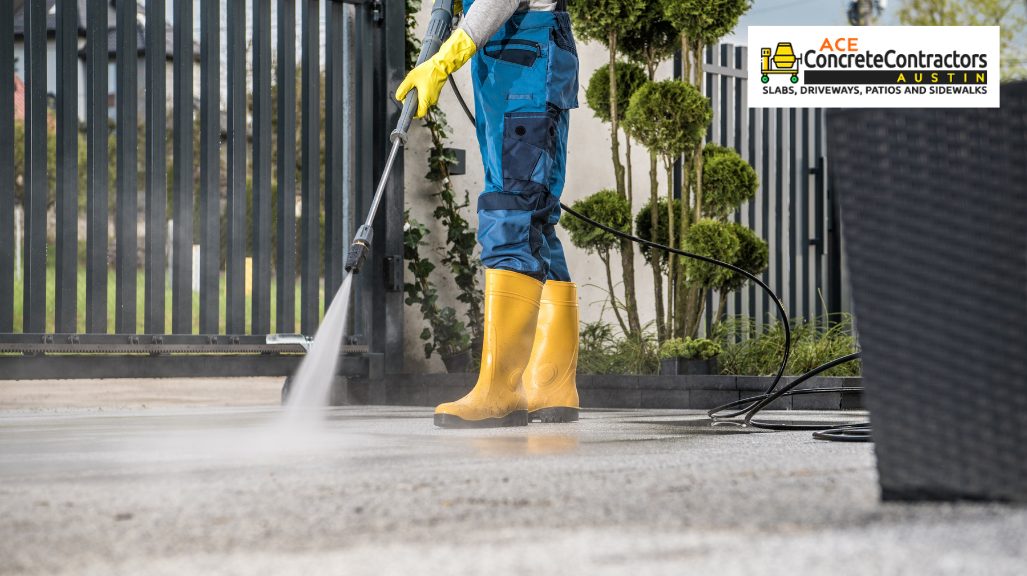 person cleaning driveway