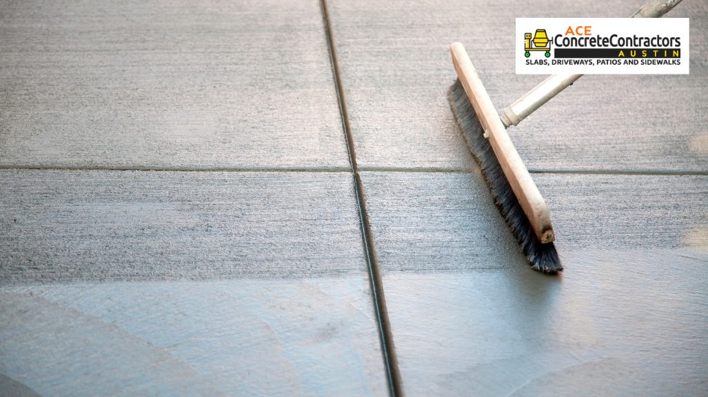 person brushing concrete surface