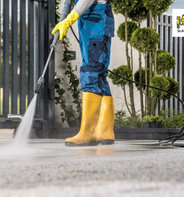 person cleaning driveway