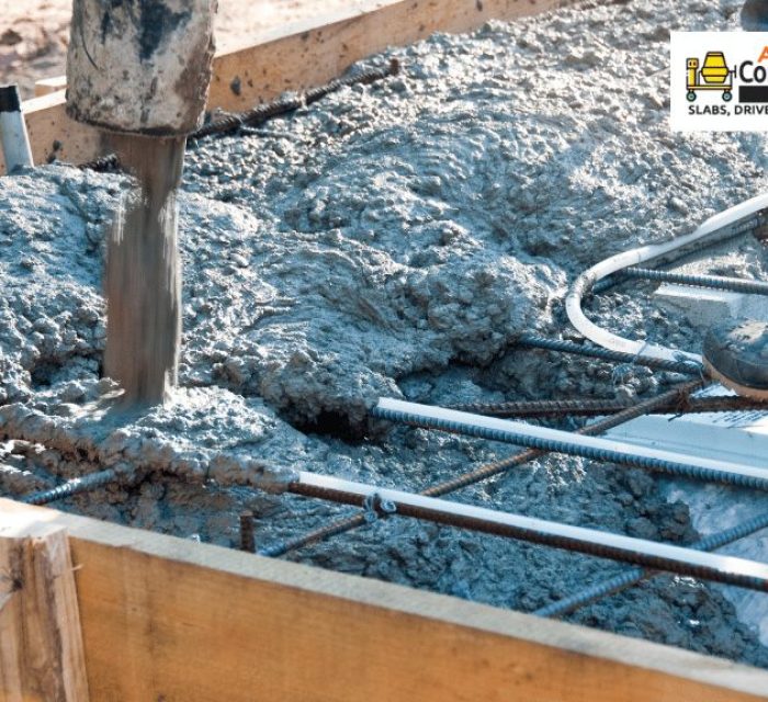 Contractor pouring a concrete mix to reinforced foundation